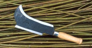 A billhook on cut willow stems